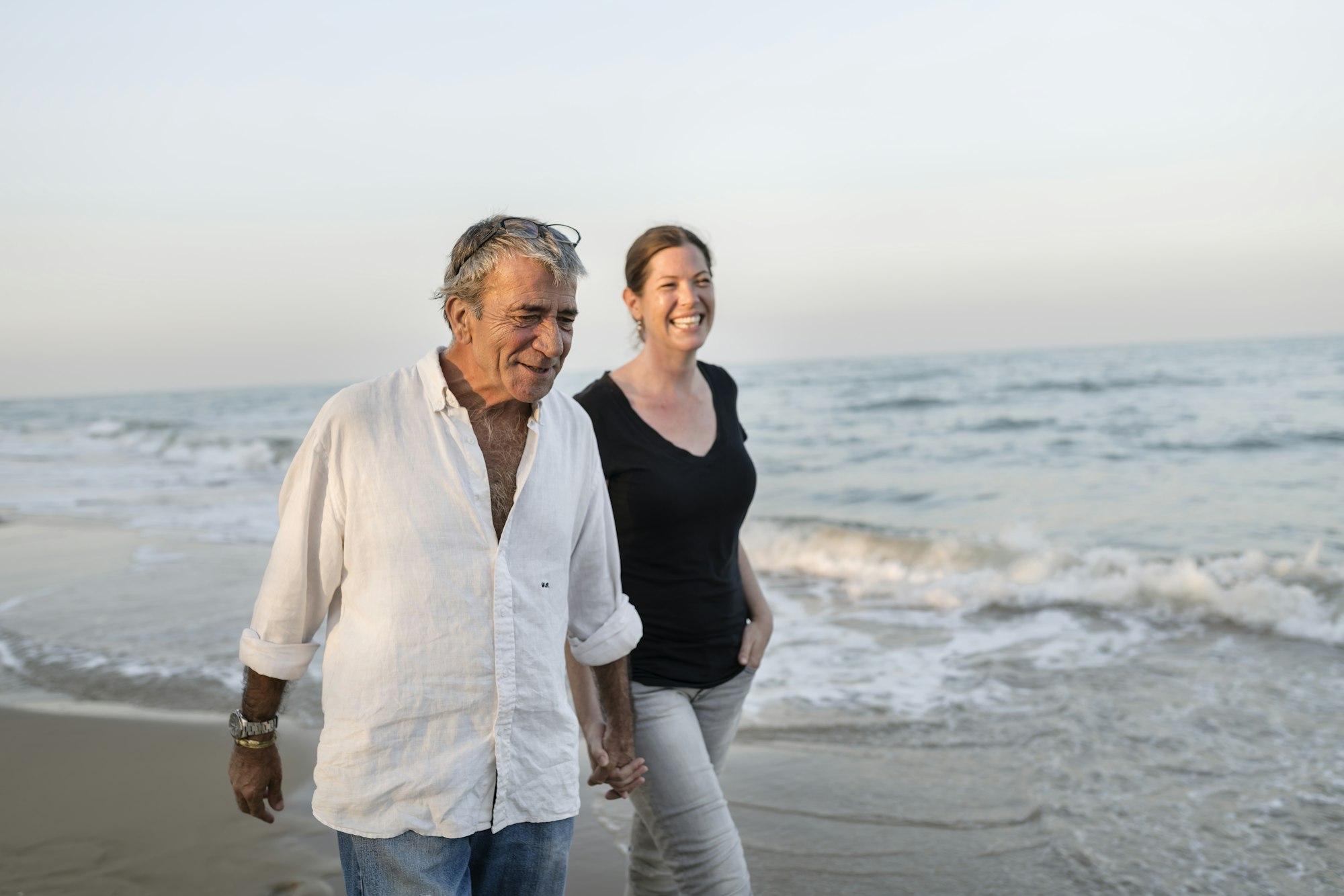 Couple walking by the seashore